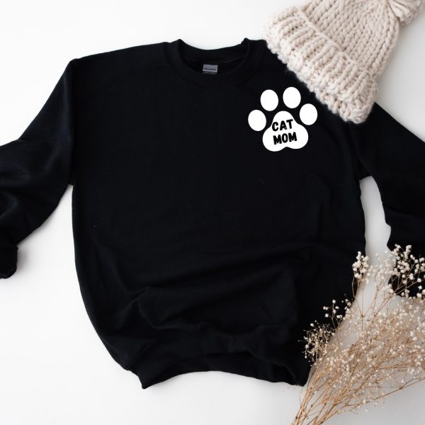 A black sweatshirt with a Cat Mom paw print on it.